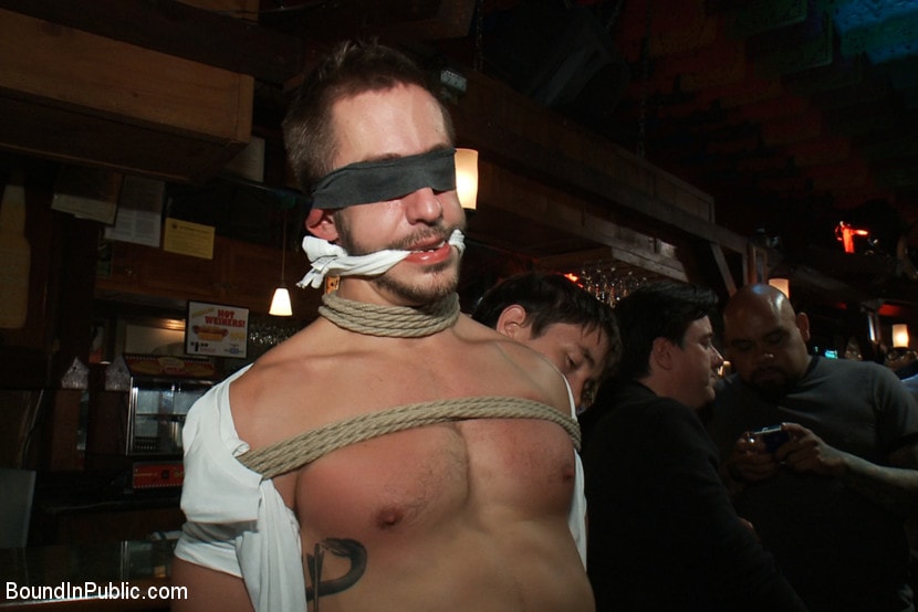Kink Men 'Naked ripped stud gets humiliated and used in a crowded public bar.' starring Adam Herst (Photo 2)