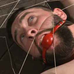Jackson Fillmore in 'Kink Men' Suspended in a center split, helpless uncut stud blows a huge load! (Thumbnail 4)