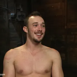 Kirk Cummings in 'Kink Men' Stud in a metal cage is fucked by horny bar patrons (Thumbnail 12)