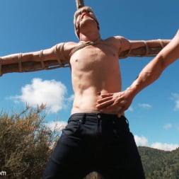 Logan Stevens in 'Kink Men' Captured and edged in the deep woods (Thumbnail 1)